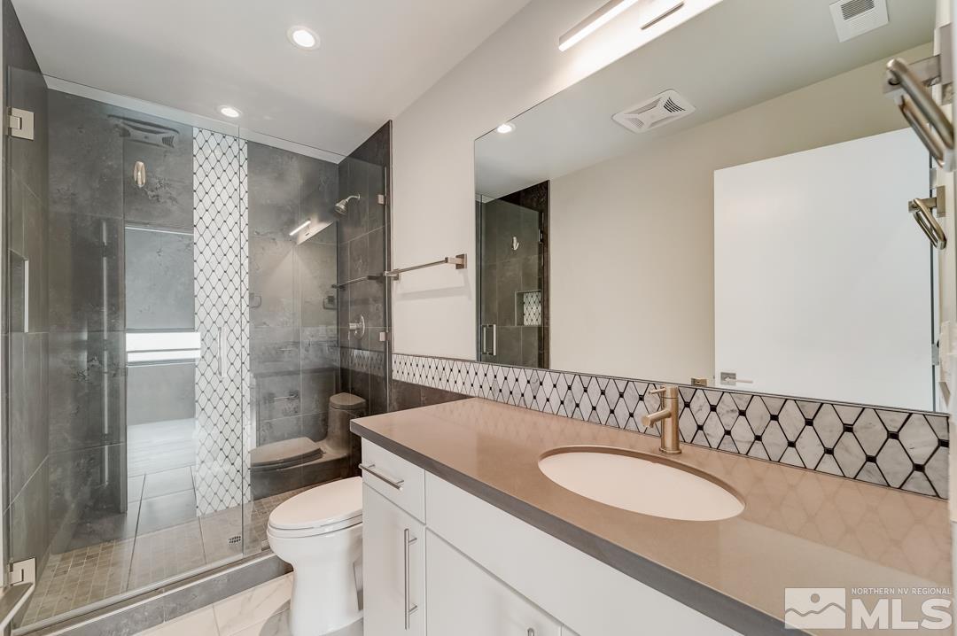 100 High Street, Unit 100 Reno, NV 89502 - Photo 4 of 20 a bathroom with a sink and a mirror