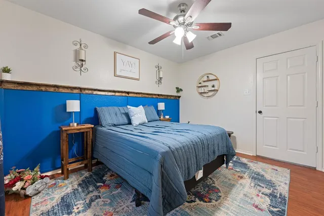 a bedroom with furniture and a chandelier