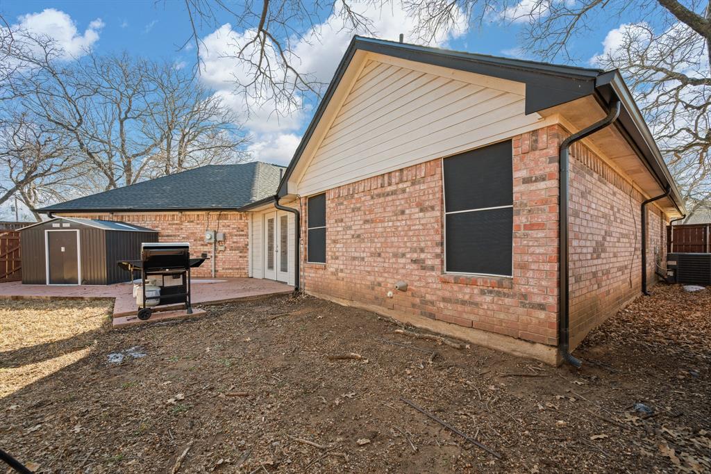 905 Evandale Road Burleson, TX 76028 - Photo 38 of 40 a view of a house with backyard and sitting area