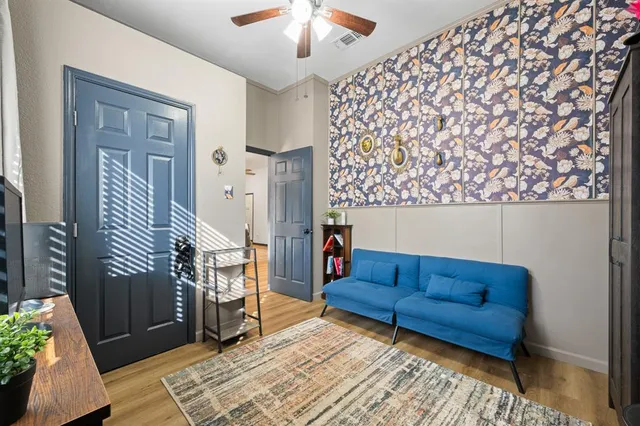 a living room with furniture and a rug