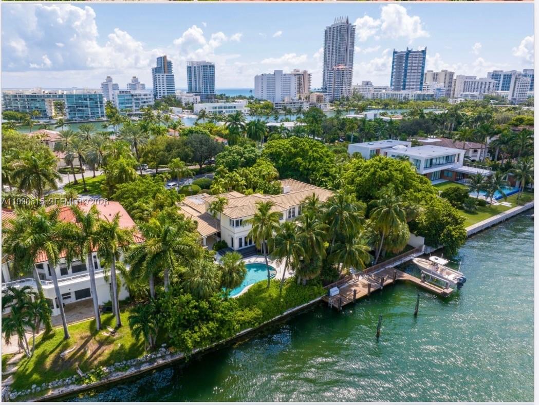 6620 Allison Road Miami Beach, FL 33141 - Photo 1 of 10 an aerial view of a city with lots of buildings and trees