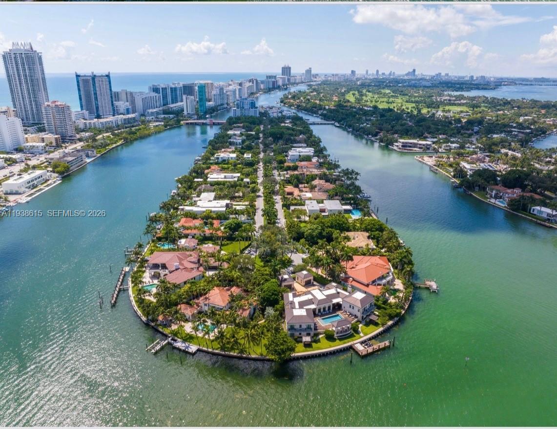6620 Allison Road Miami Beach, FL 33141 - Photo 4 of 10 a view of a swimming pool with a yard