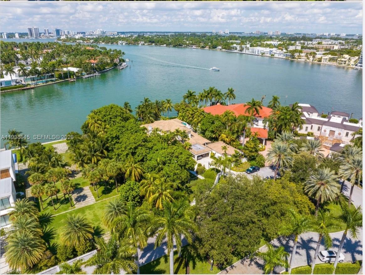 6620 Allison Road Miami Beach, FL 33141 - Photo 6 of 10 an aerial view of a houses with a lake view