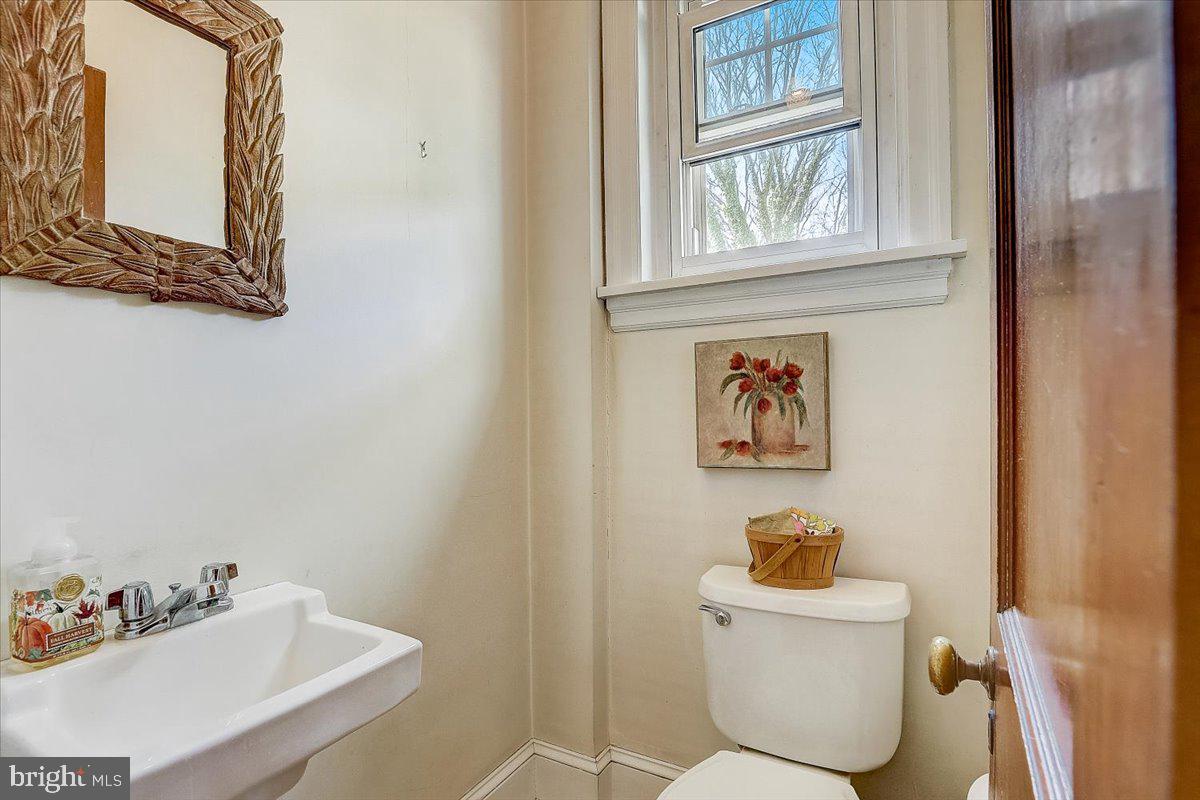 1525 Limekiln Pike Dresher, PA 19025 - Photo 17 of 52 a bathroom with a toilet a sink and a window
