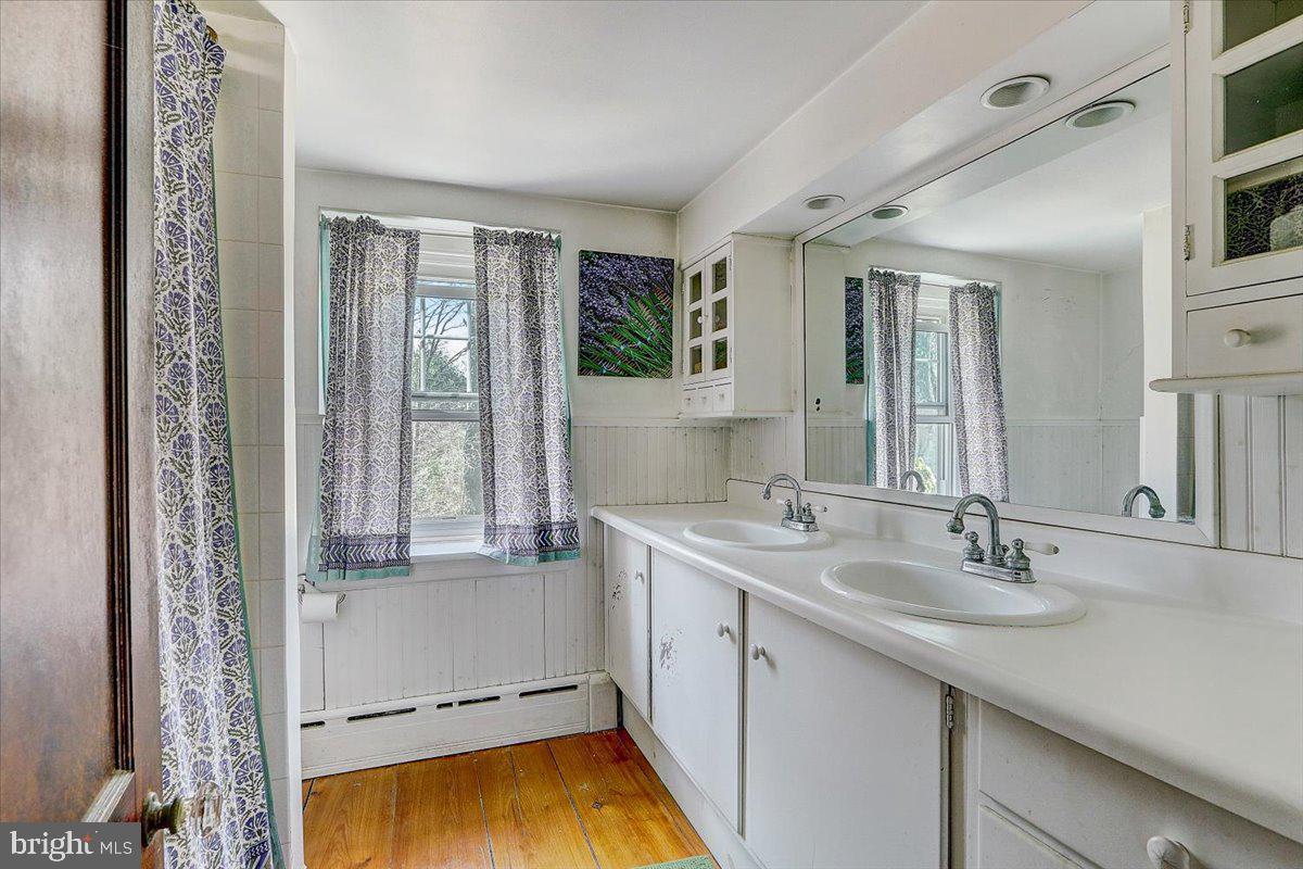 1525 Limekiln Pike Dresher, PA 19025 - Photo 23 of 52 a bathroom with a sink and a bathtub