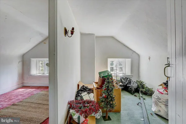 a view of a livingroom with furniture and toys