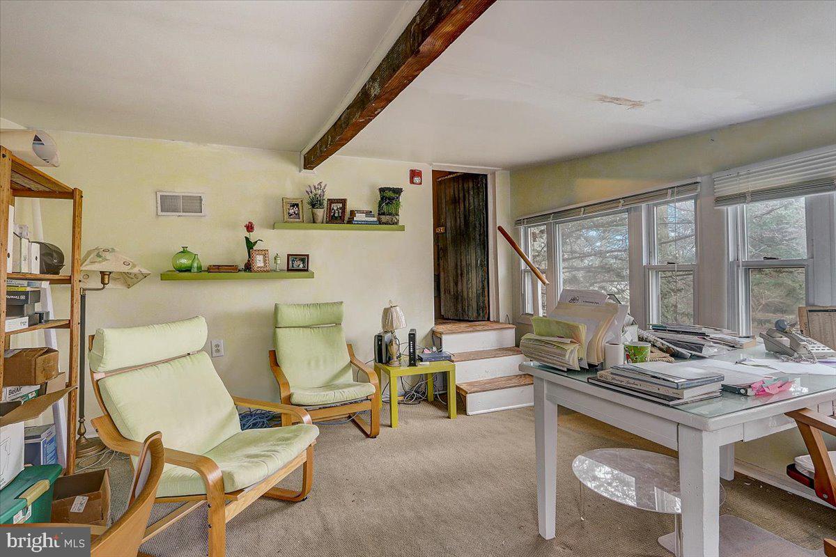 1525 Limekiln Pike Dresher, PA 19025 - Photo 46 of 52 a living room with furniture and a floor to ceiling window