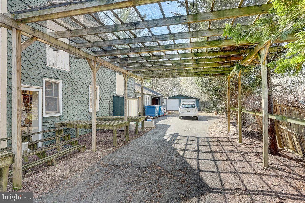 1525 Limekiln Pike Dresher, PA 19025 - Photo 47 of 52 a view of a porch with a table and chairs