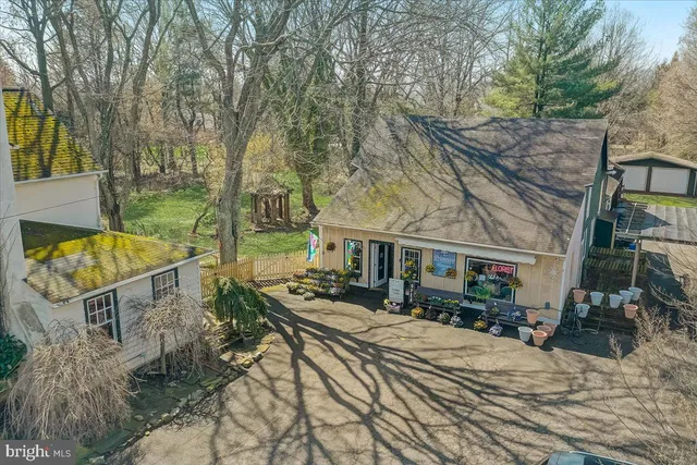 a aerial view of a house with a yard