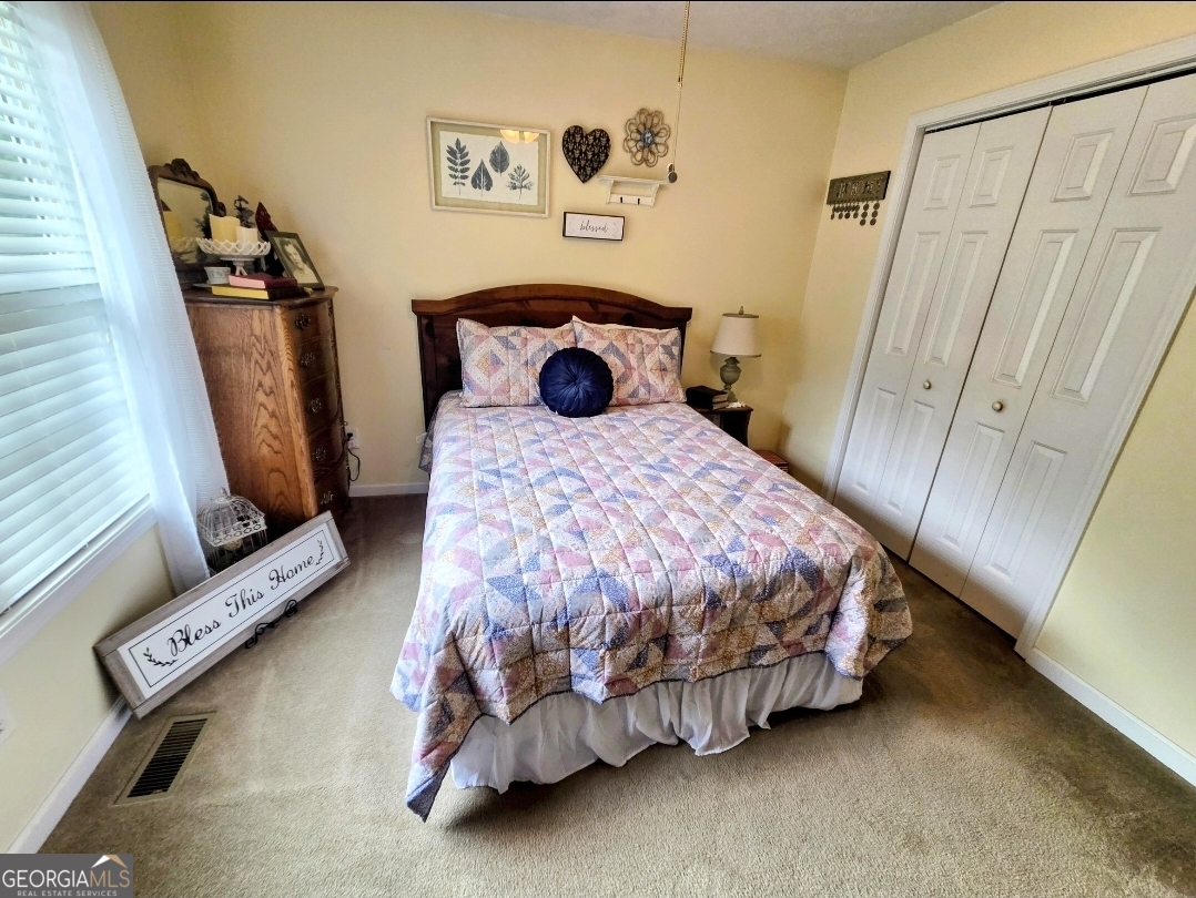 21 Baskin Heights Path Temple, GA 30179 - Photo 25 of 44 a bedroom with a bed and a window