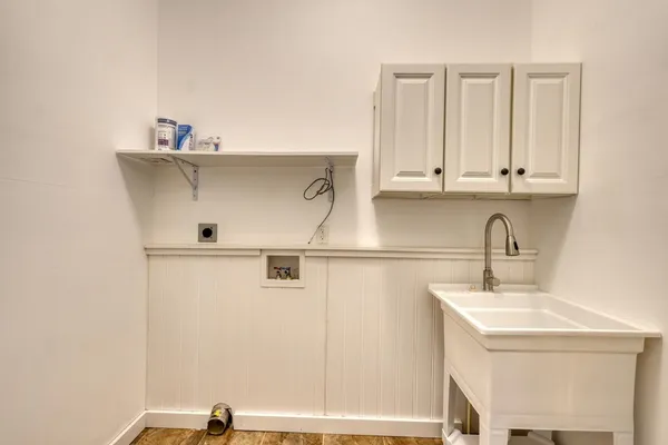 a bathroom with a sink and cabinets