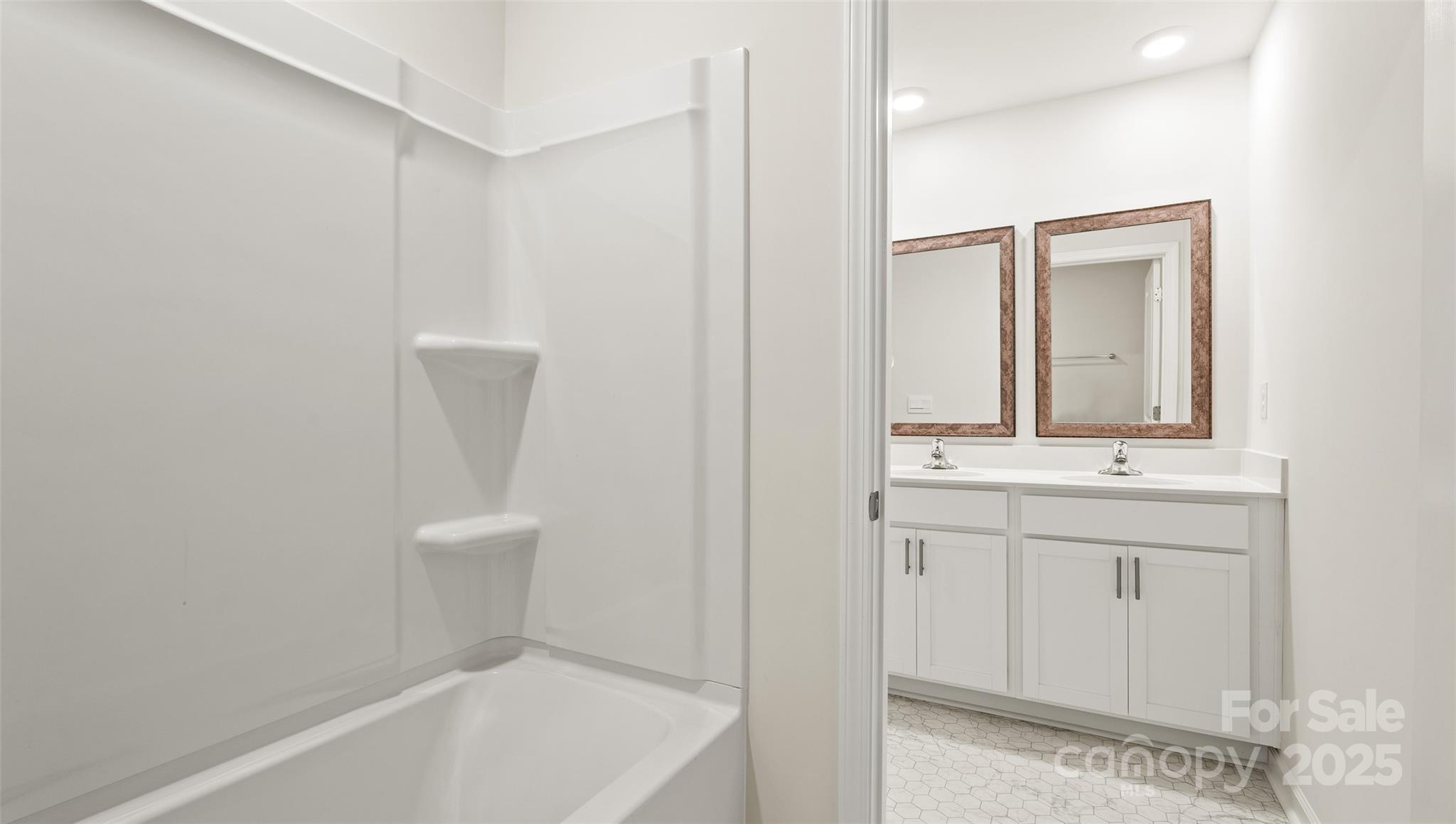 155 Callie River Clyde, NC 28721 - Photo 27 of 29 a bathroom with a sink a toilet and mirror
