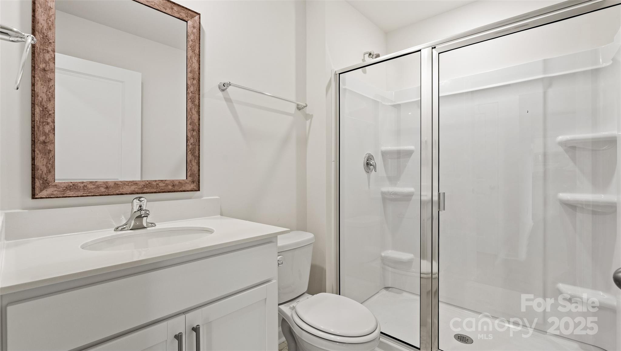 155 Callie River Clyde, NC 28721 - Photo 28 of 29 a bathroom with a sink a toilet and shower