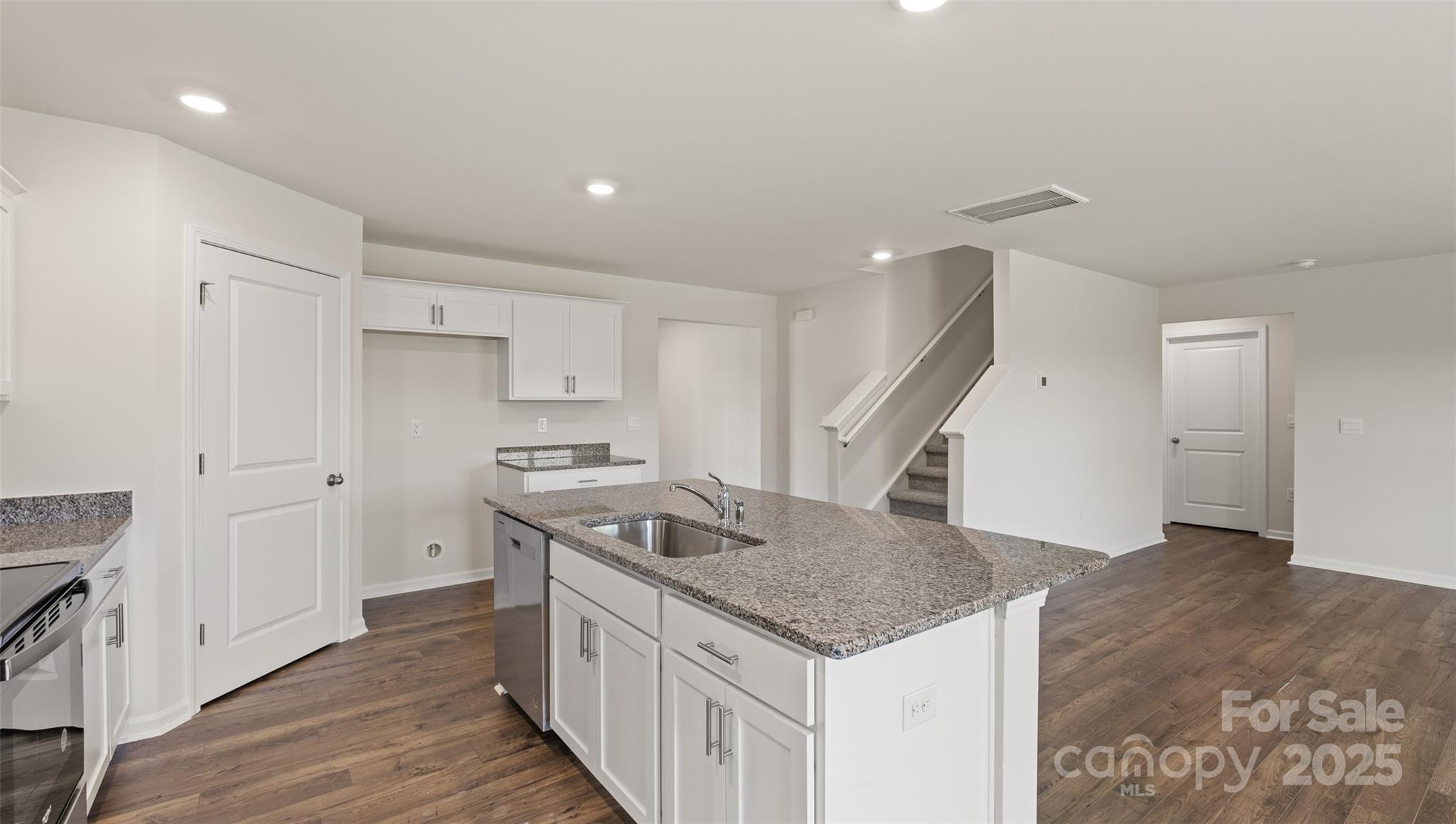 155 Callie River Clyde, NC 28721 - Photo 6 of 29 a kitchen that has a sink a stove and a wooden floor