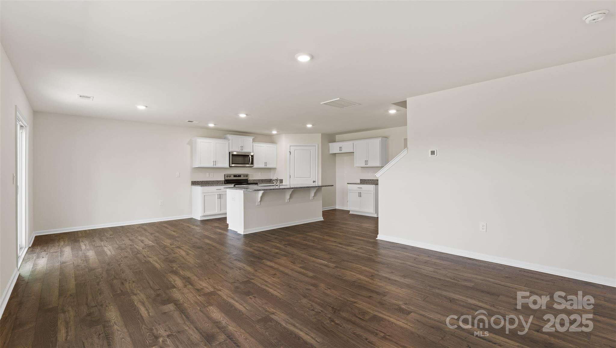 155 Callie River Clyde, NC 28721 - Photo 10 of 29 a view of kitchen with wooden floor and window