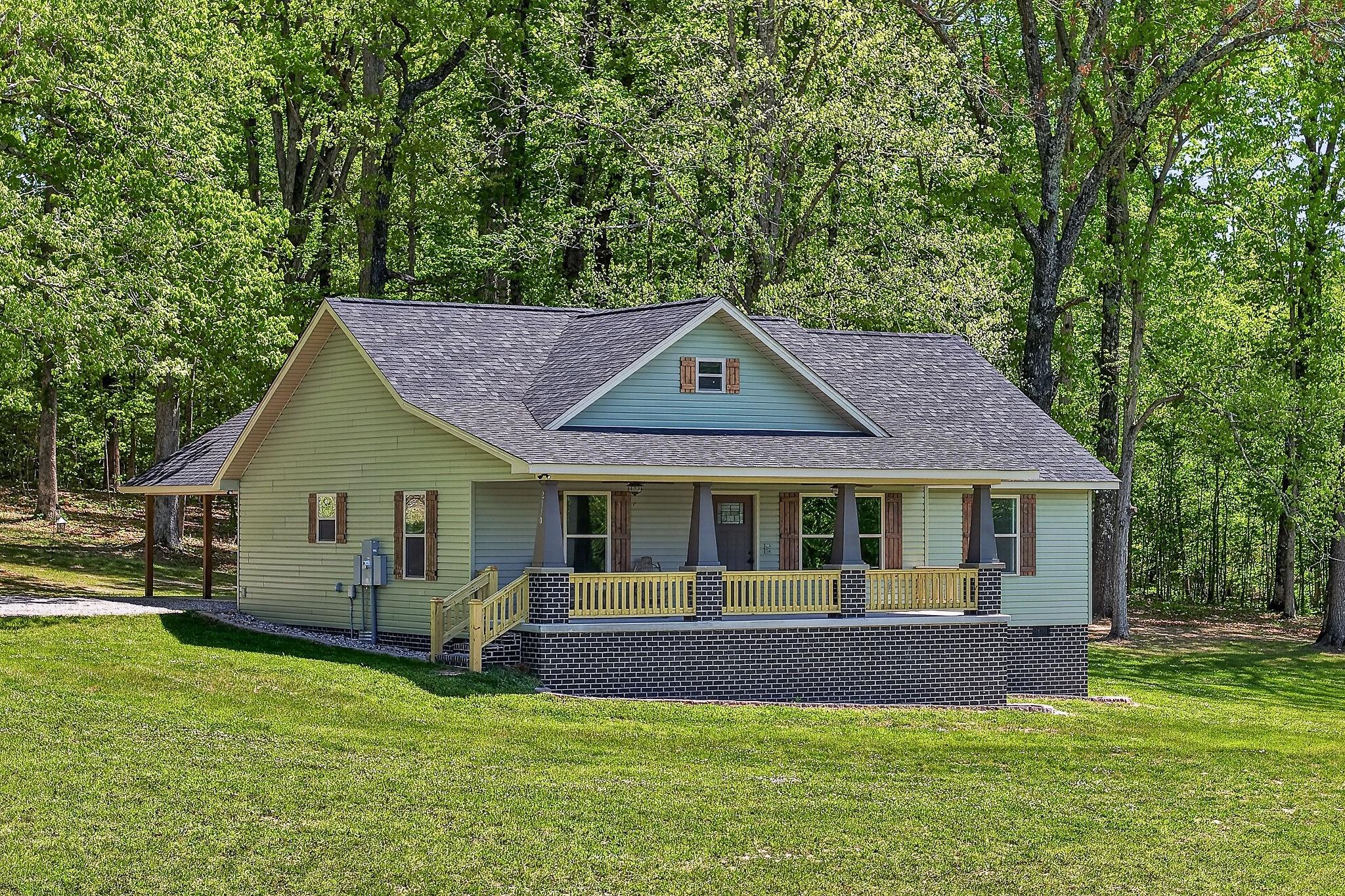 2110 Windle Community Road Cookeville, TN 38506 - Photo 1 of 35 a front view of a house with a yard