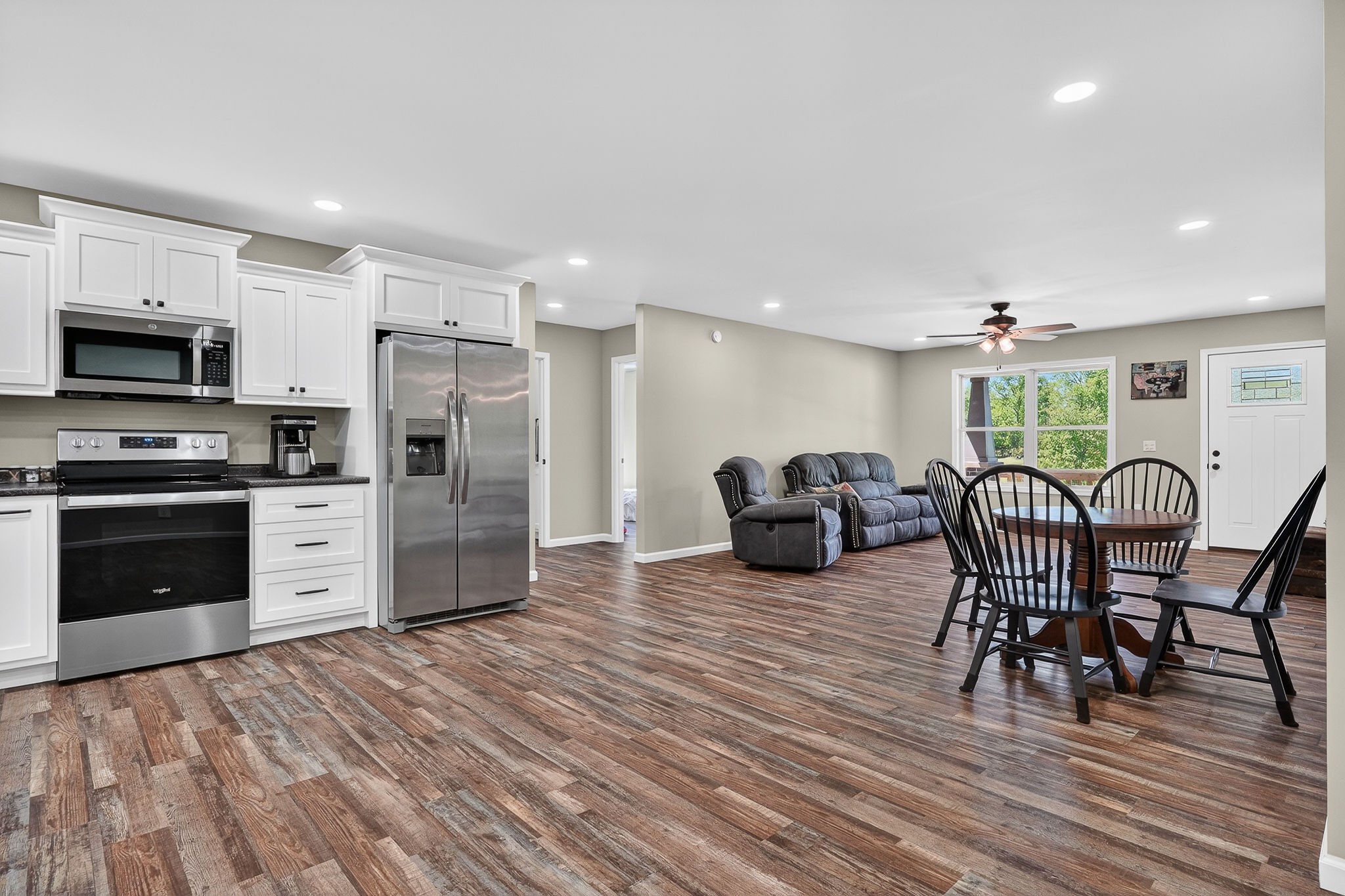 2110 Windle Community Road Cookeville, TN 38506 - Photo 17 of 35 a kitchen with furniture a refrigerator and a dining table