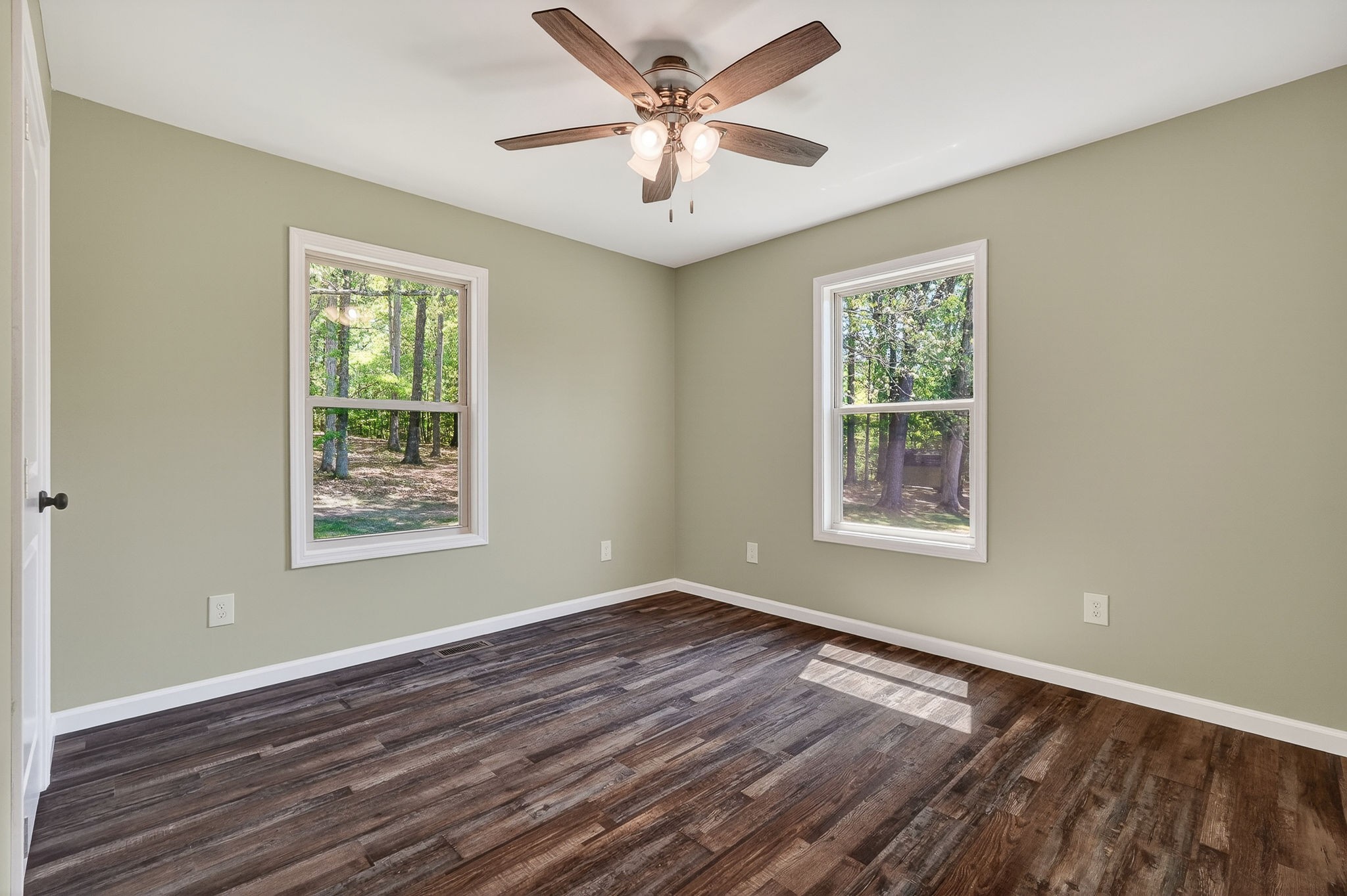 2110 Windle Community Road Cookeville, TN 38506 - Photo 25 of 35 a view of a livingroom with a fan a large window with wooden floor