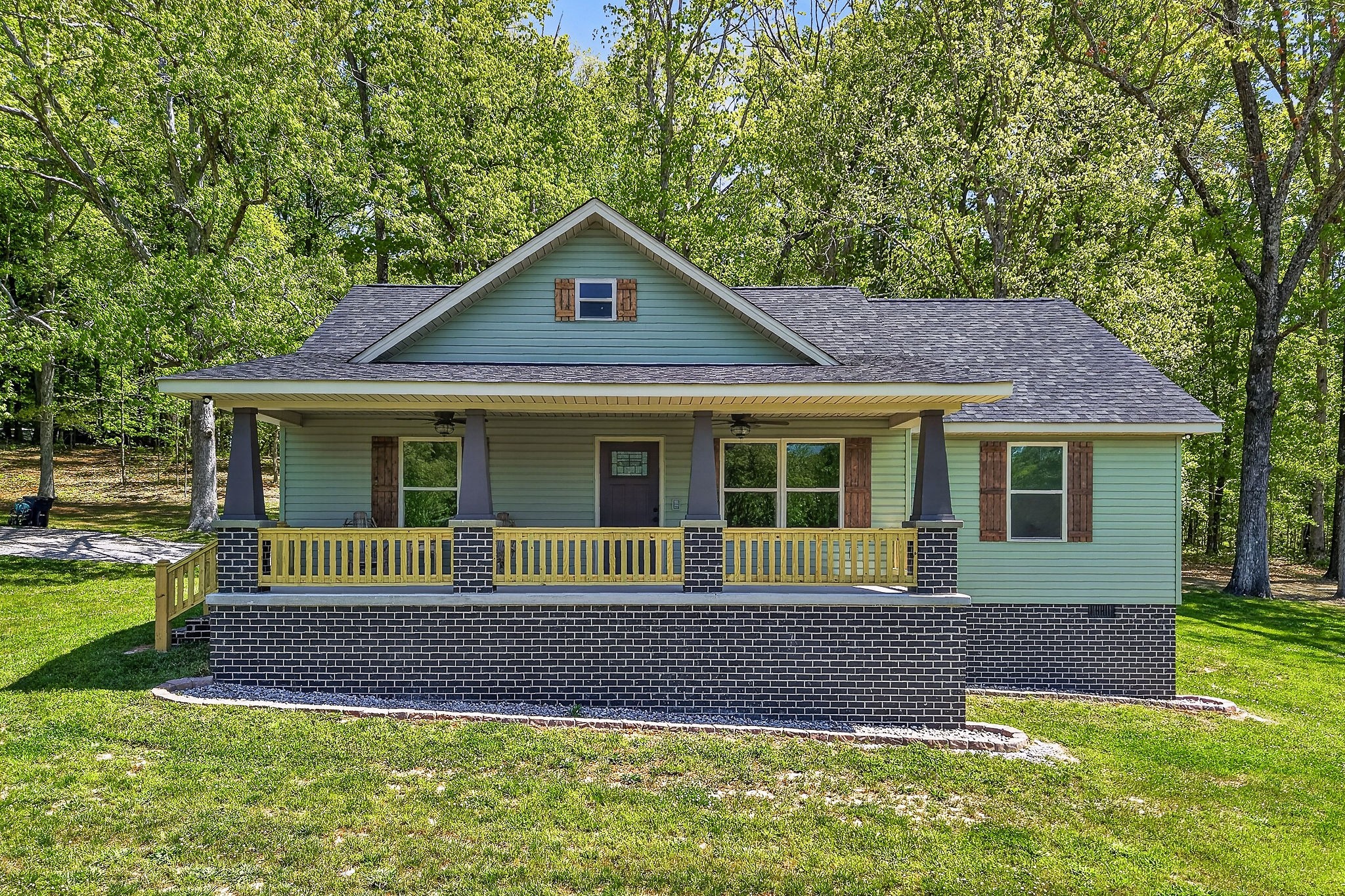 2110 Windle Community Road Cookeville, TN 38506 - Photo 3 of 35 a front view of a house with a garden
