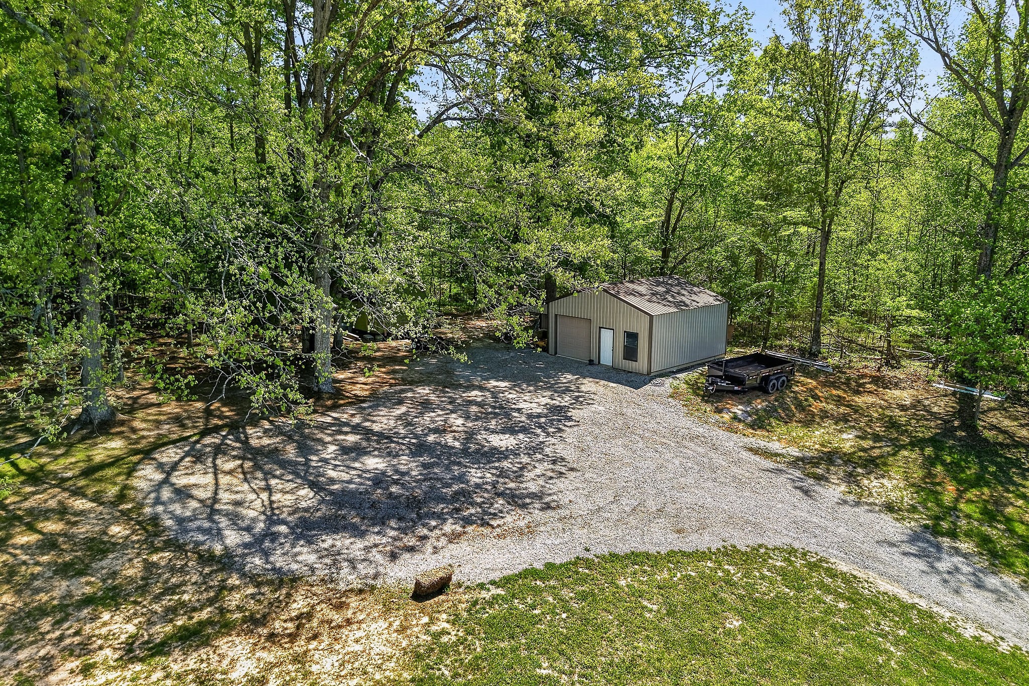 2110 Windle Community Road Cookeville, TN 38506 - Photo 5 of 35 a backyard of a house with a tree