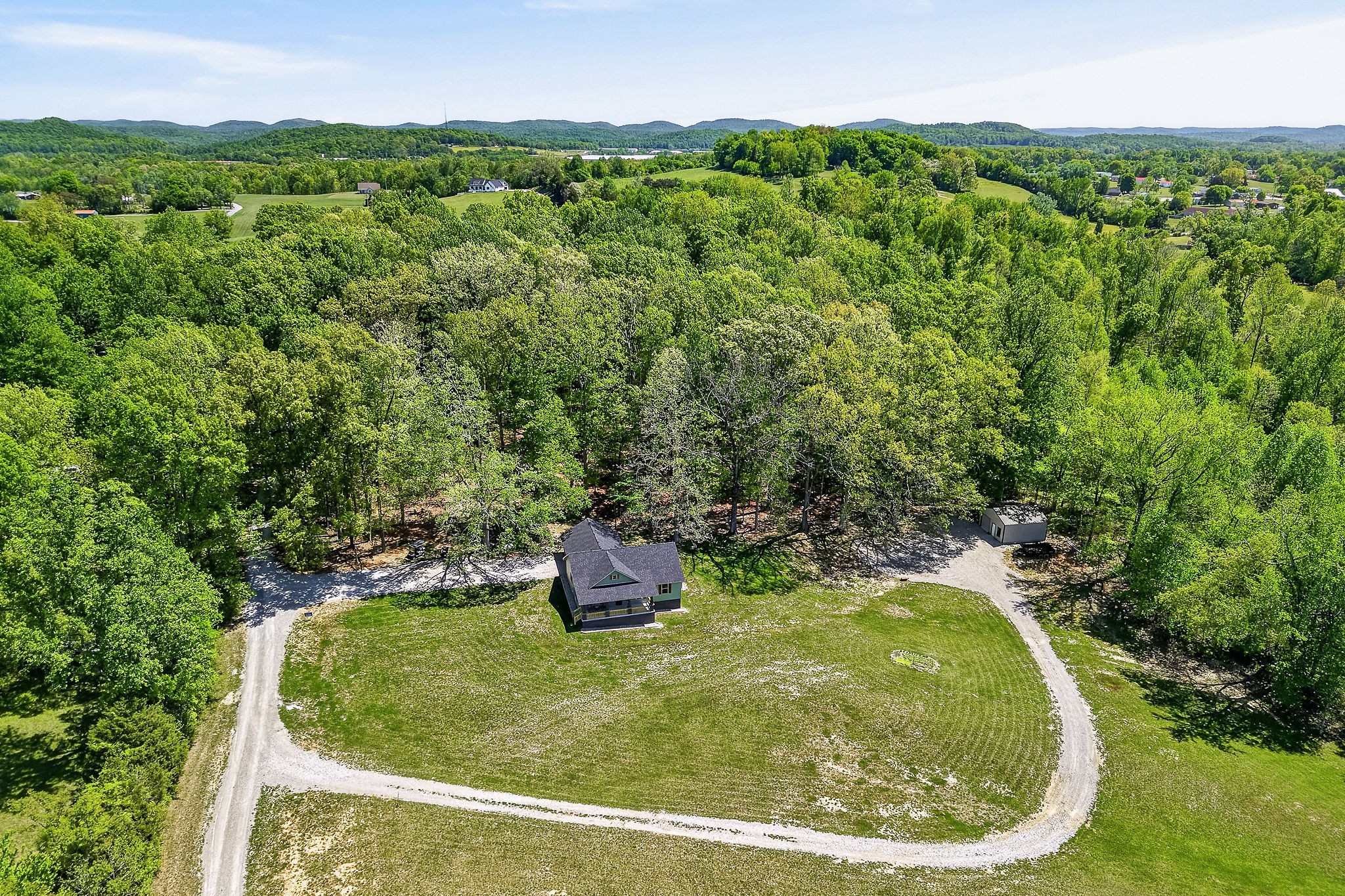 2110 Windle Community Road Cookeville, TN 38506 - Photo 6 of 35 a view of a back yard from a tub