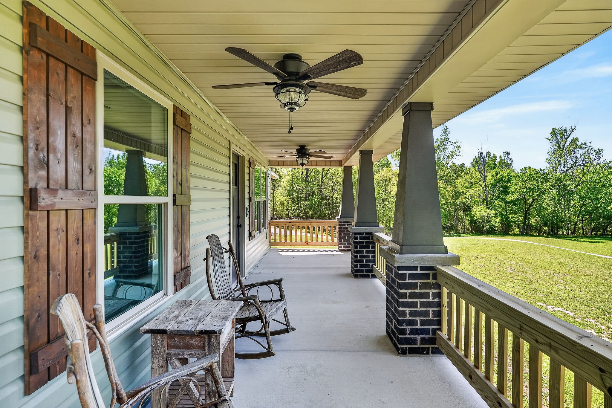 2110 Windle Community Road Cookeville, TN 38506 - Photo 10 of 35 a view of a porch with furniture and a backyard