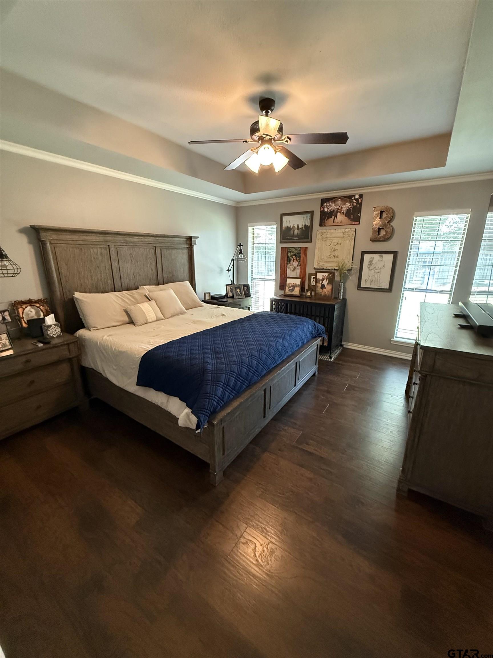 3207 McDonald Road Tyler, TX 75701 - Photo 11 of 24 a spacious bedroom with a bed and dresser