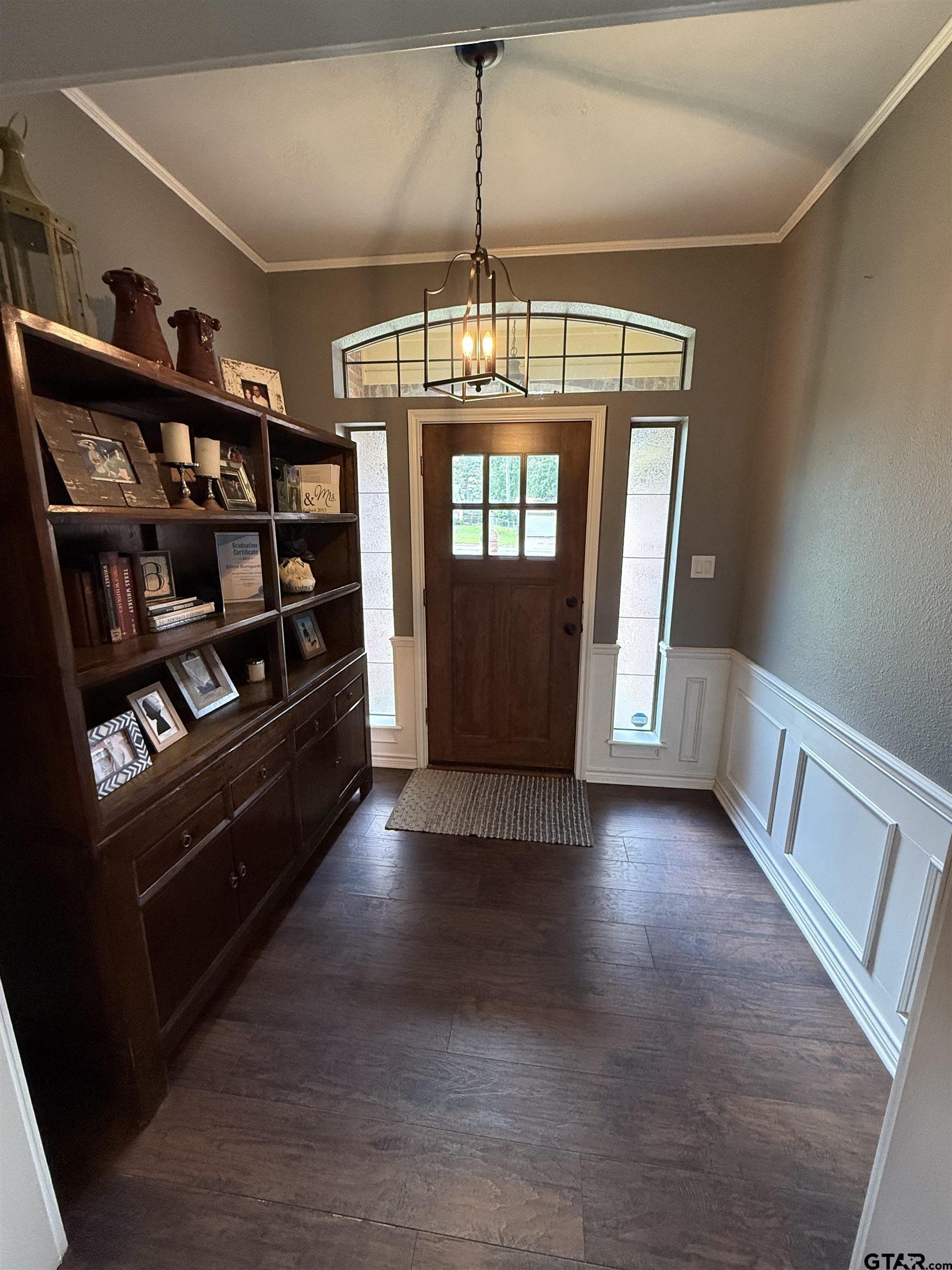 3207 McDonald Road Tyler, TX 75701 - Photo 2 of 24 a view of an empty room with wooden floor and windows