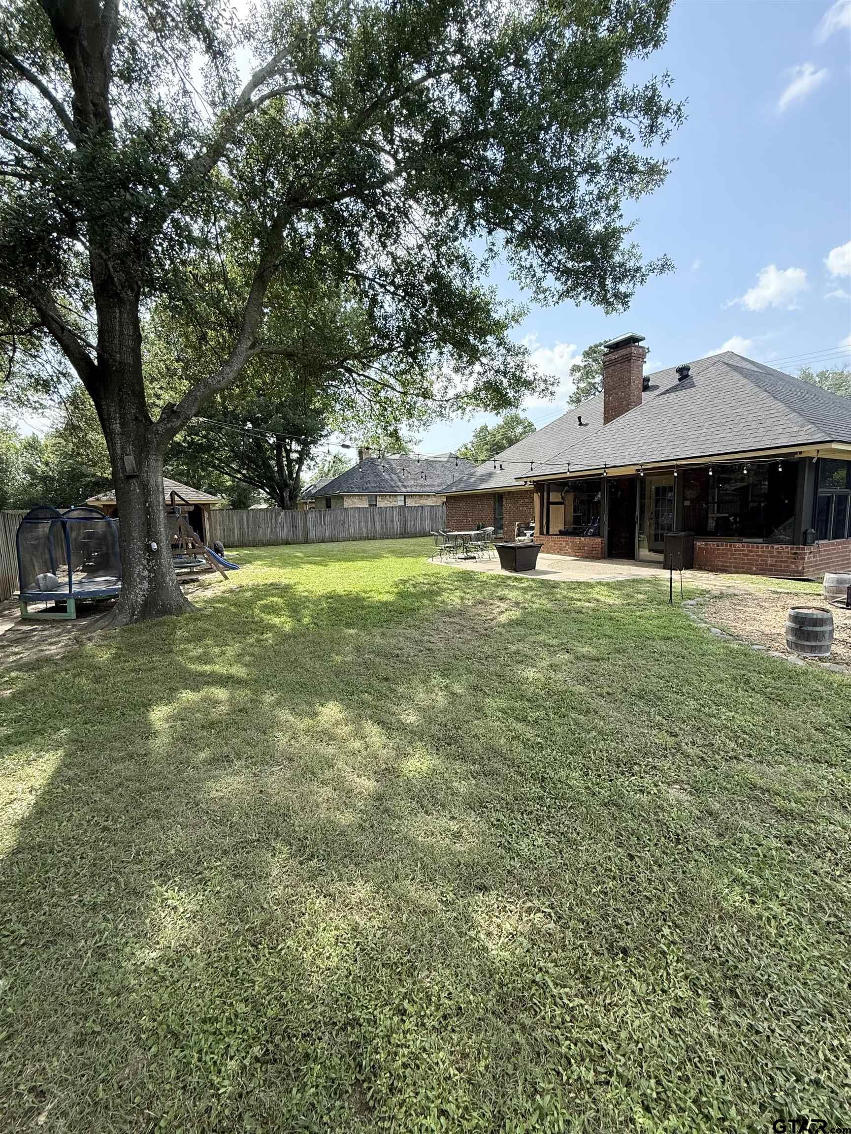 3207 McDonald Road Tyler, TX 75701 - Photo 23 of 24 a view of a house with swimming pool and sitting area