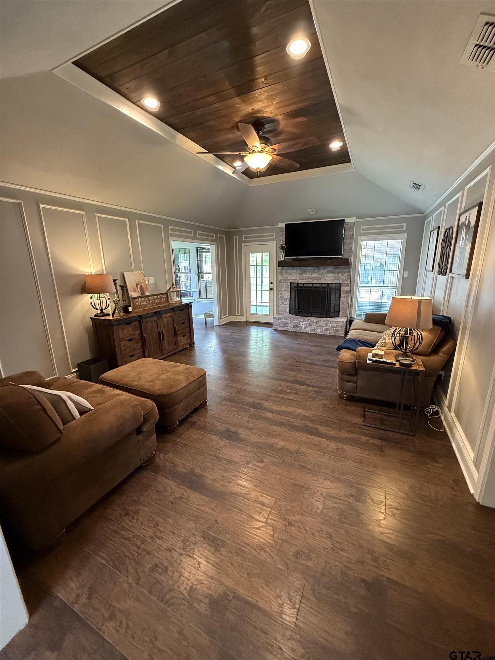 3207 McDonald Road Tyler, TX 75701 - Photo 4 of 24 a bedroom with furniture and a flat screen tv
