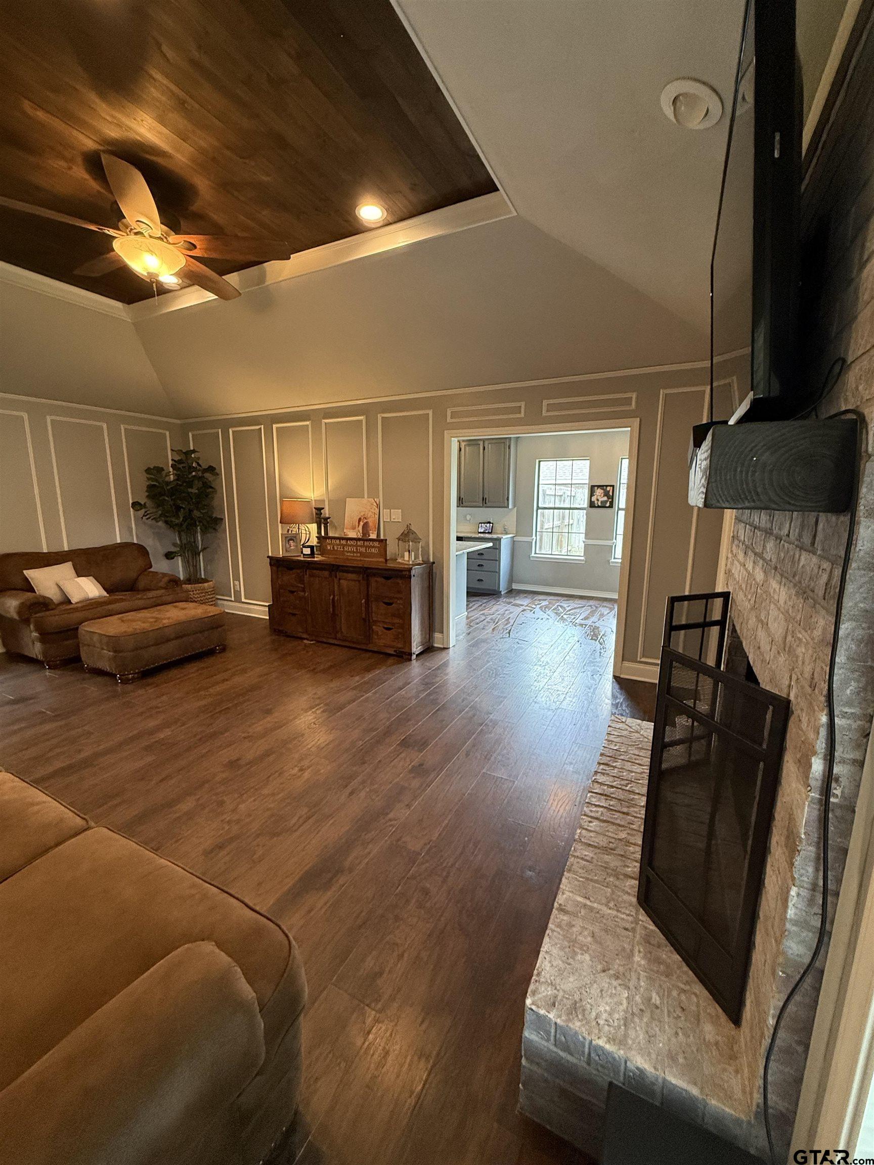 3207 McDonald Road Tyler, TX 75701 - Photo 5 of 24 a living room with furniture and a flat screen tv