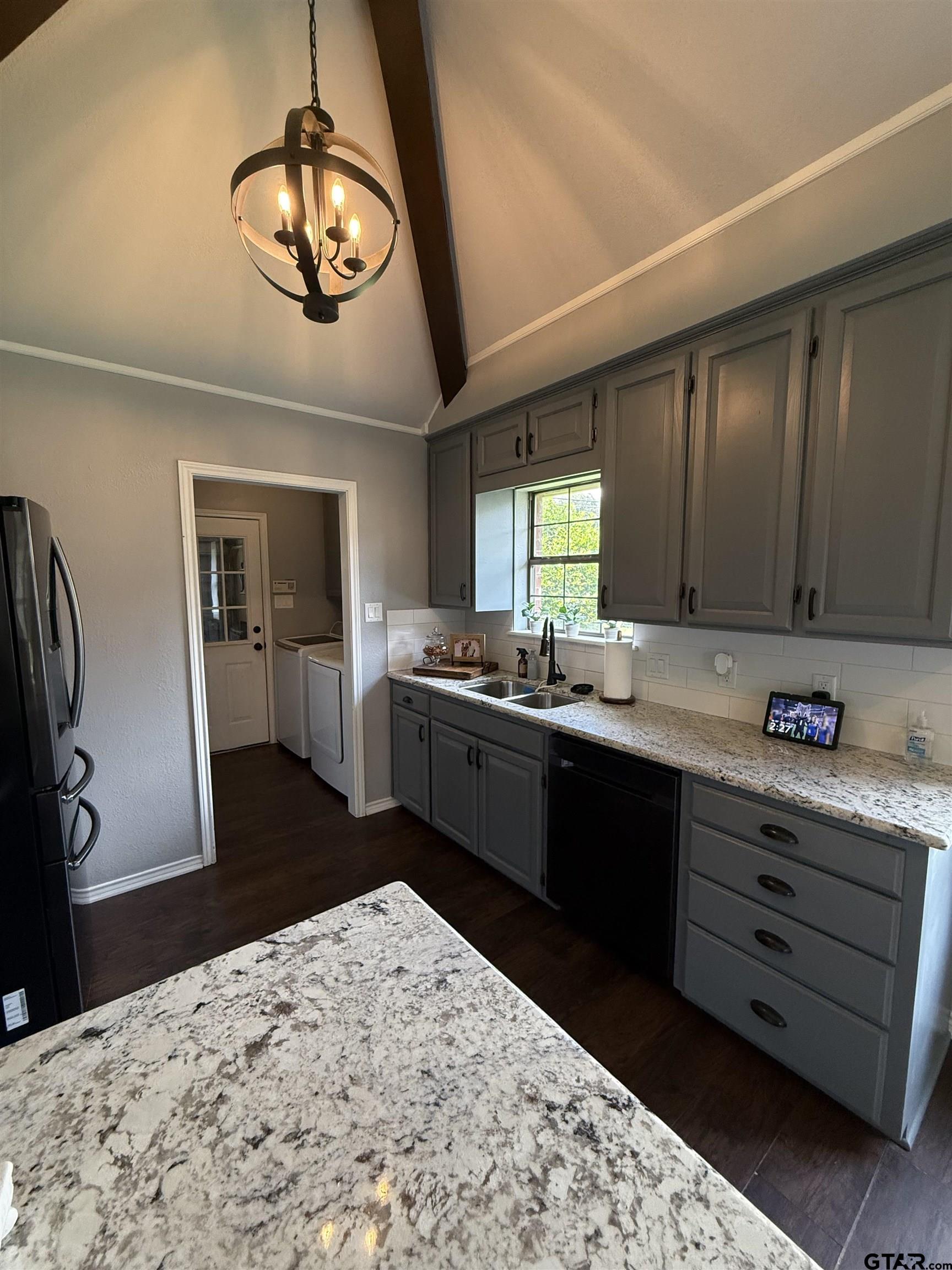 3207 McDonald Road Tyler, TX 75701 - Photo 9 of 24 a kitchen with stainless steel appliances kitchen island granite countertop a refrigerator a stove sink and dishwasher