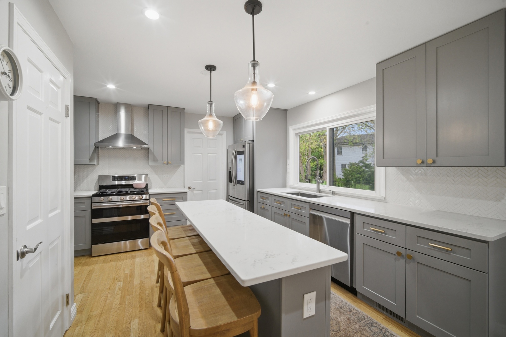 2831 Farmington Road Northbrook, IL 60062 - Photo 7 of 33 a kitchen with kitchen island a stove a sink a center island and cabinets