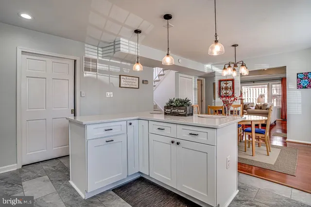 a view of a kitchen and dining room cabinets