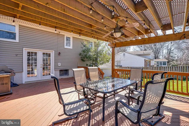 a view of a patio with a table and chairs