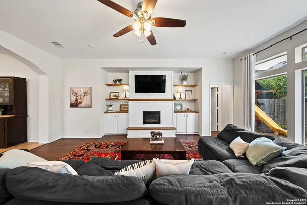 a living room with furniture and a flat screen tv