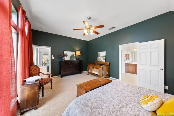 a bedroom with furniture and a chandelier