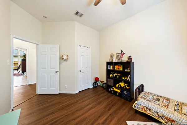 a view of a workspace with wooden floor
