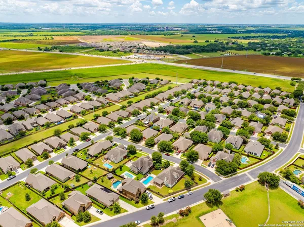 a view of a swimming pool with a table and chairs