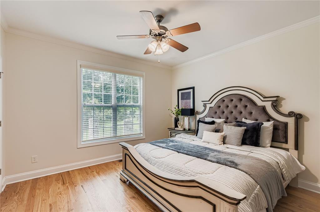 7641 Capps Ridge Lane Douglasville, GA 30135 - Photo 11 of 26 a bedroom with a bed and a large window