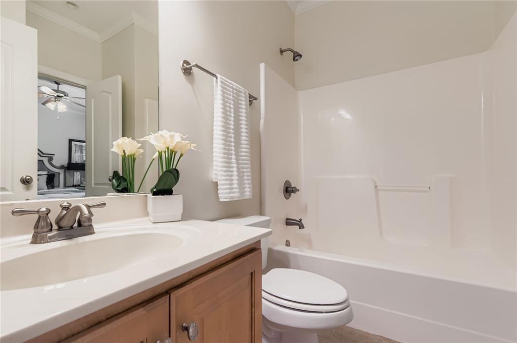 7641 Capps Ridge Lane Douglasville, GA 30135 - Photo 12 of 26 a bathroom with a sink a toilet and shower