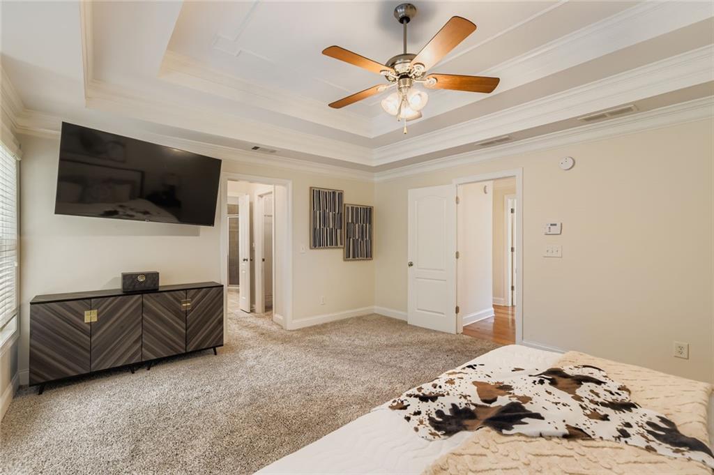 7641 Capps Ridge Lane Douglasville, GA 30135 - Photo 14 of 26 a bedroom with a bed and a flat screen tv