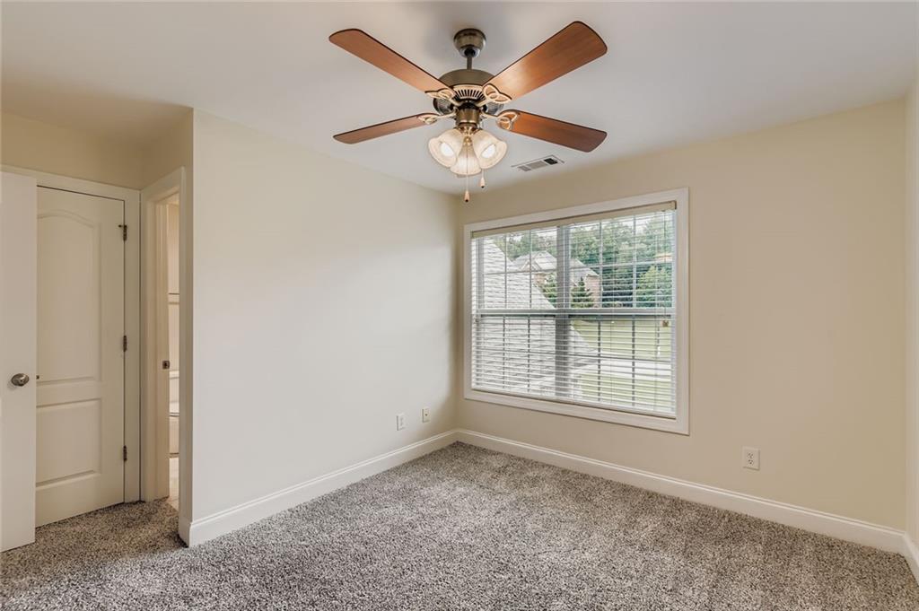 7641 Capps Ridge Lane Douglasville, GA 30135 - Photo 18 of 26 a view of an empty room with a window