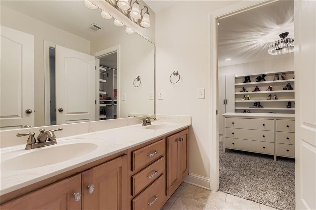 7641 Capps Ridge Lane Douglasville, GA 30135 - Photo 20 of 26 a bathroom with a sink and a mirror