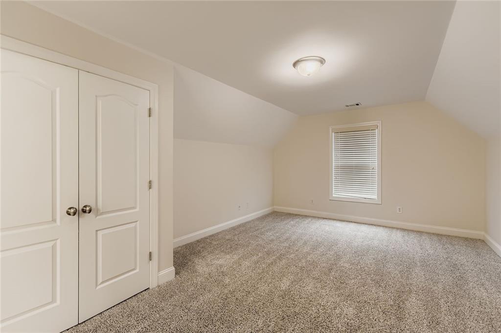 7641 Capps Ridge Lane Douglasville, GA 30135 - Photo 21 of 26 a view of an empty room with a window