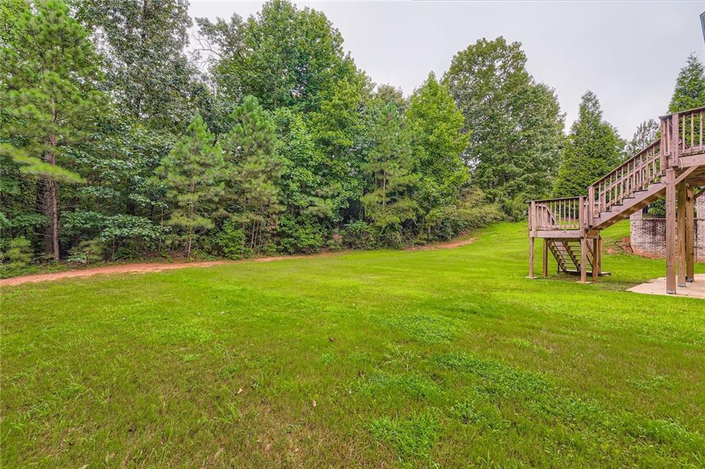 7641 Capps Ridge Lane Douglasville, GA 30135 - Photo 24 of 26 a view of a house with a yard