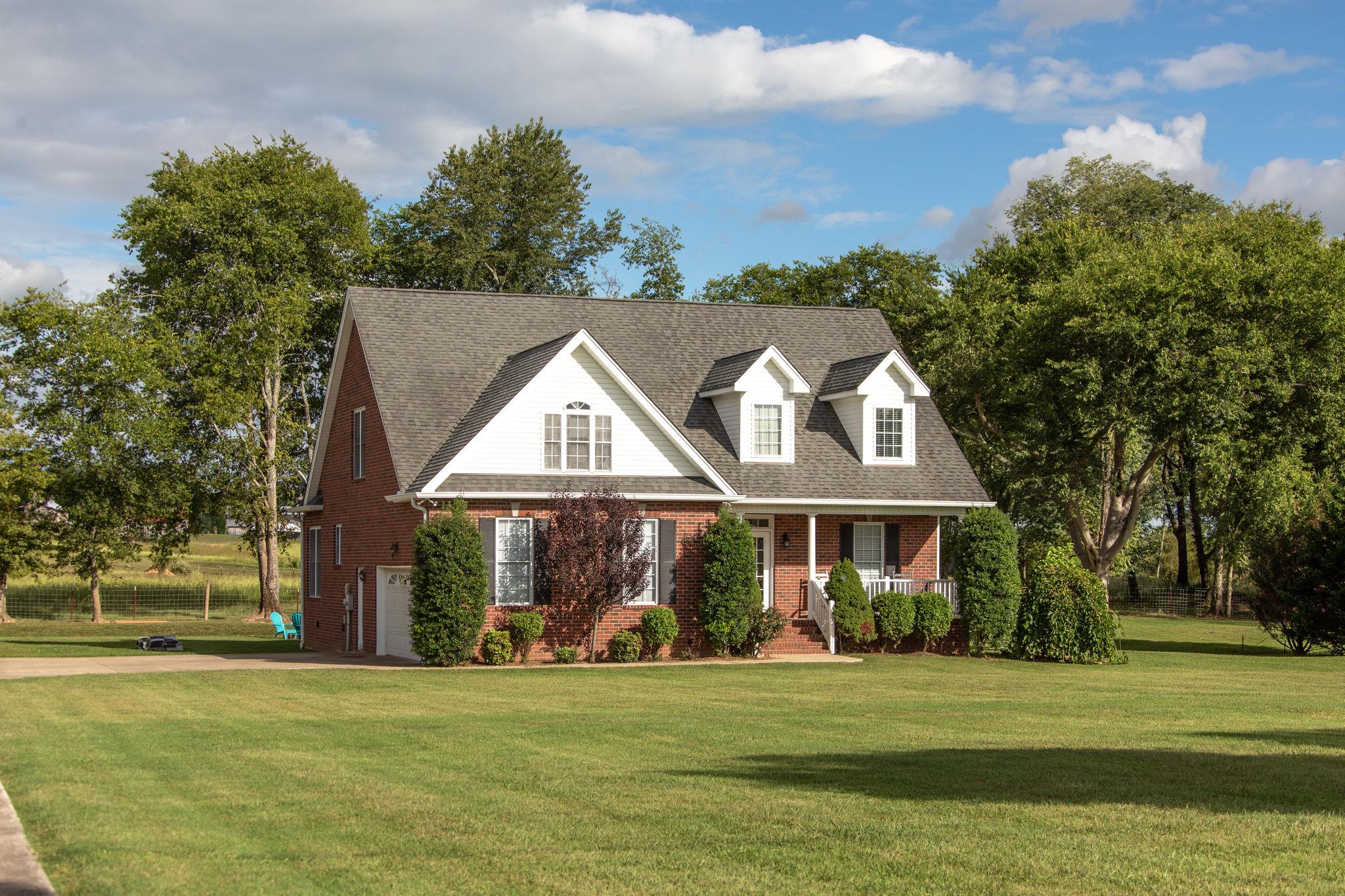 1207 Maple Hill Road Lebanon, TN 37087 - Photo 1 of 29 a front view of a house with a garden