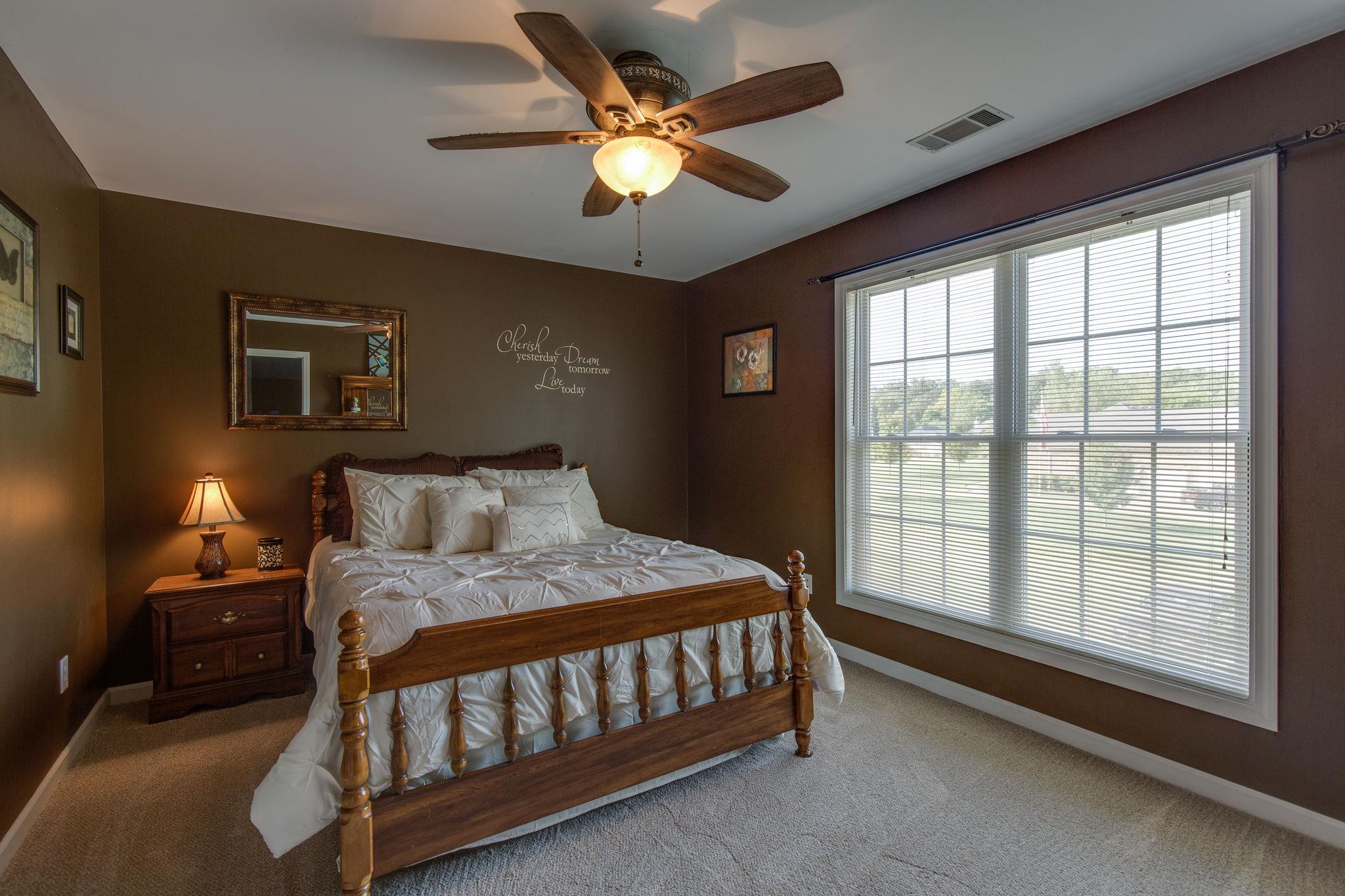 1207 Maple Hill Road Lebanon, TN 37087 - Photo 20 of 29 a bedroom with a bed and a large window