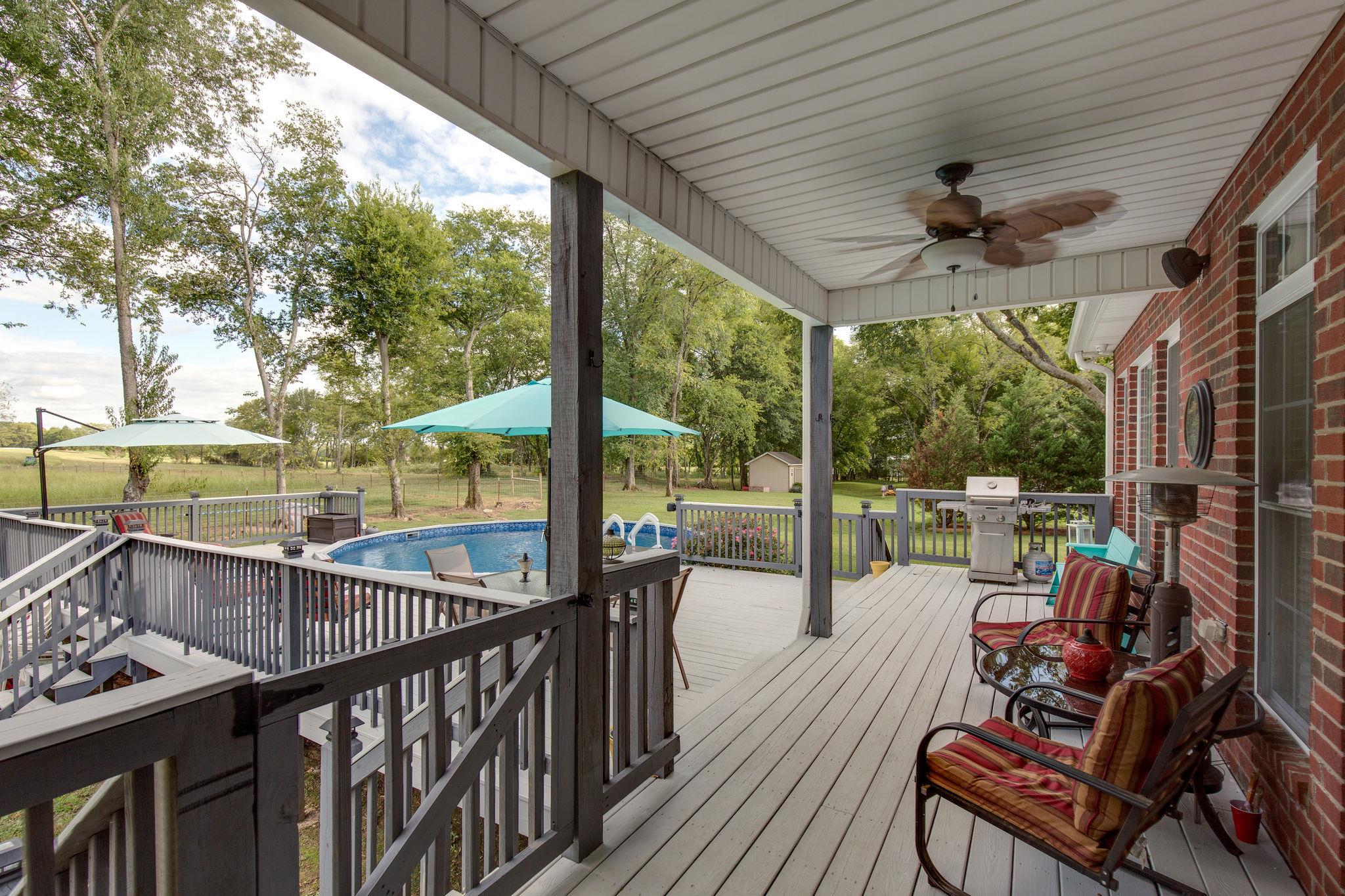 1207 Maple Hill Road Lebanon, TN 37087 - Photo 23 of 29 a view of a porch with furniture and wooden floor