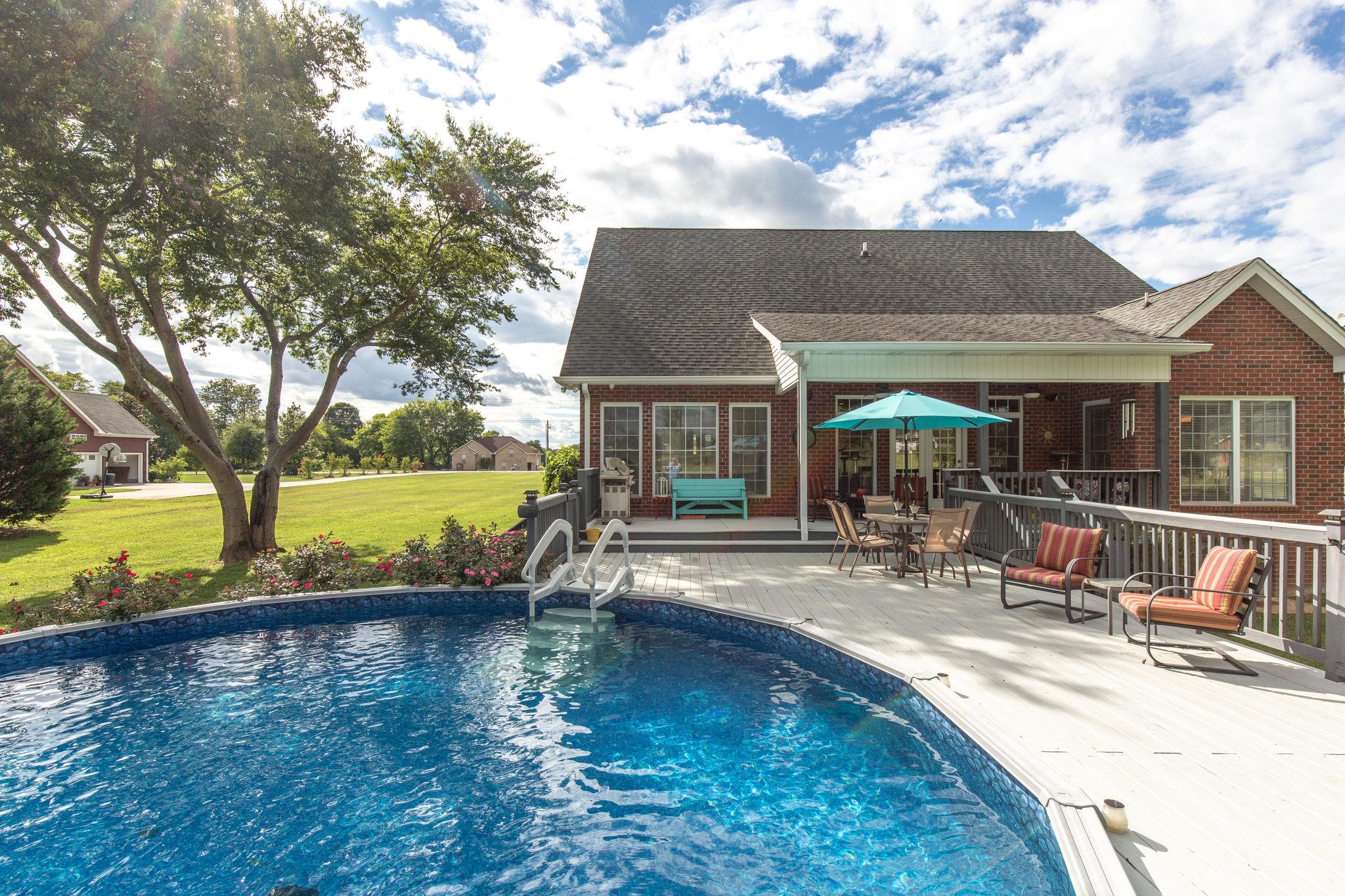 1207 Maple Hill Road Lebanon, TN 37087 - Photo 25 of 29 swimming pool view with a seating space and a garden